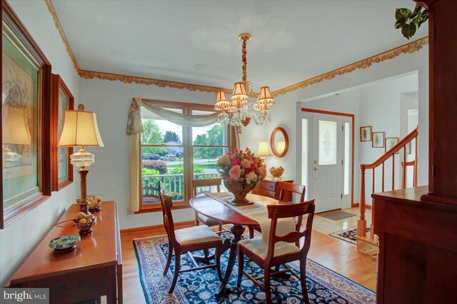 8 Roger Ave, Shippensburg, PA 17257 - dining space with a chandelier, light wood finished floors, stairway, and baseboards