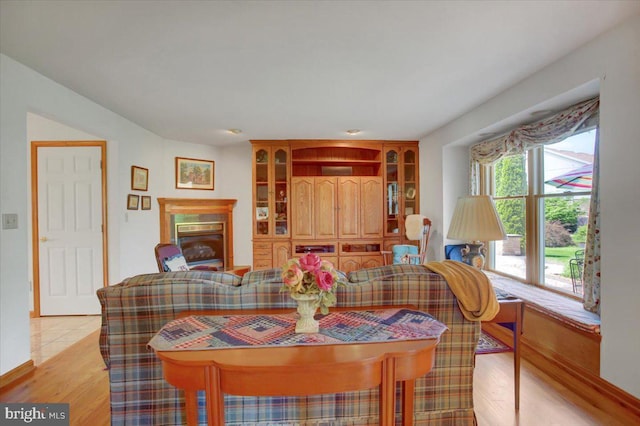 8 Roger Ave, Shippensburg, PA 17257 - dining space featuring a glass covered fireplace and light wood-type flooring