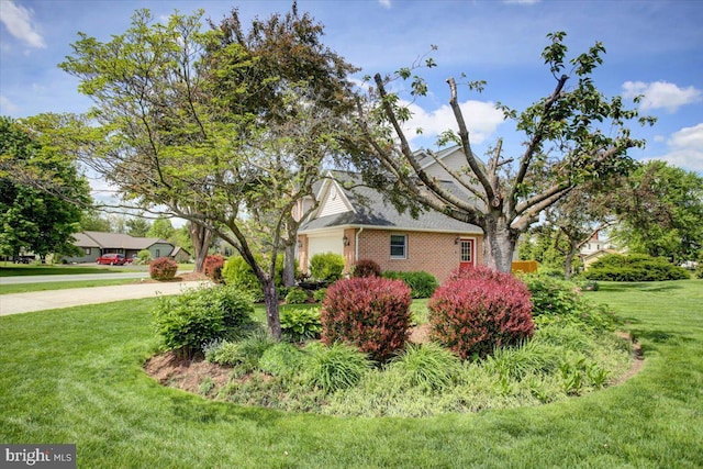 8 Roger Ave, Shippensburg, PA 17257 - view of side of property featuring an attached garage, a yard, and brick siding