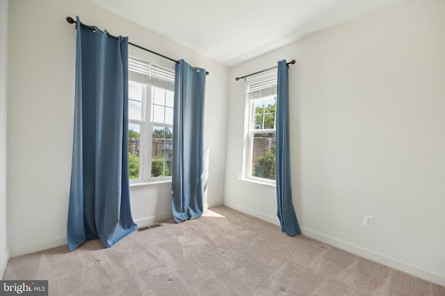 7201 Wood Pond Cir, Lanham, MD 20706 - carpeted empty room with plenty of natural light and baseboards