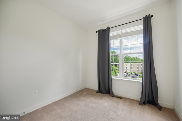 7201 Wood Pond Cir, Lanham, MD 20706 - unfurnished room with baseboards and light carpet