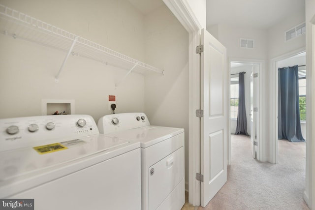 7201 Wood Pond Cir, Lanham, MD 20706 - laundry area with washing machine and clothes dryer and light colored carpet
