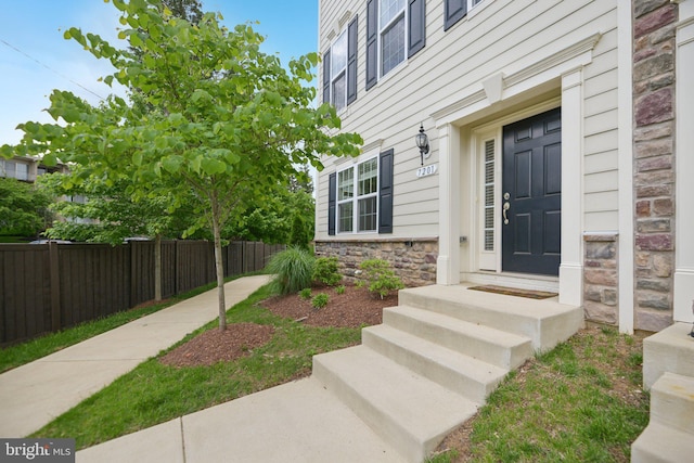7201 Wood Pond Cir, Lanham, MD 20706 - entrance to property featuring fence and stone siding
