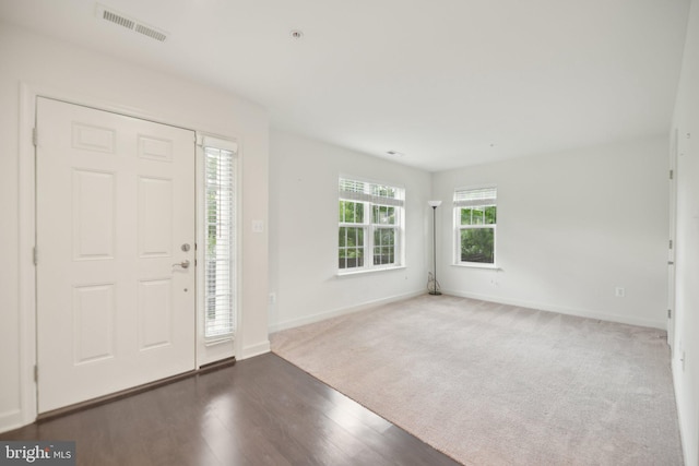 7201 Wood Pond Cir, Lanham, MD 20706 - carpeted entrance foyer with baseboards and wood finished floors