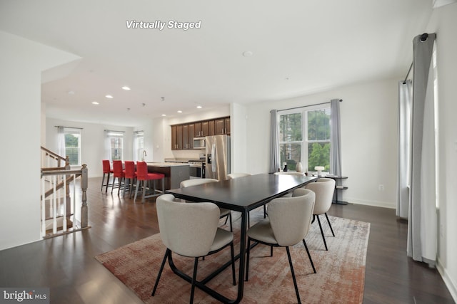 7201 Wood Pond Cir, Lanham, MD 20706 - dining space with healthy amount of natural light, recessed lighting, stairs, dark wood finished floors, and baseboards