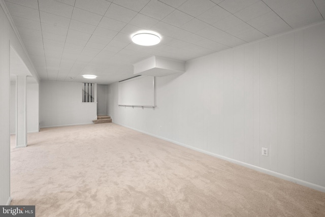 finished below grade area featuring carpet floors and baseboards
