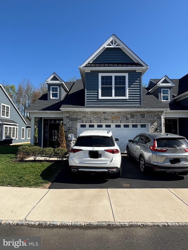 916 Holden Ct, Warminster, PA 18974 - view of front of property featuring a standing seam roof, a garage, concrete driveway, a shingled roof, and stone siding