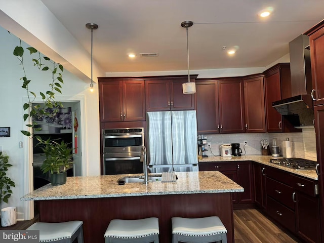 916 Holden Ct, Warminster, PA 18974 - kitchen with appliances with stainless steel finishes, a kitchen breakfast bar, wall chimney exhaust hood, and visible vents
