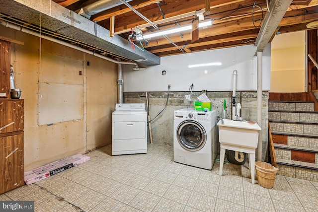 laundry area with laundry area and independent washer and dryer