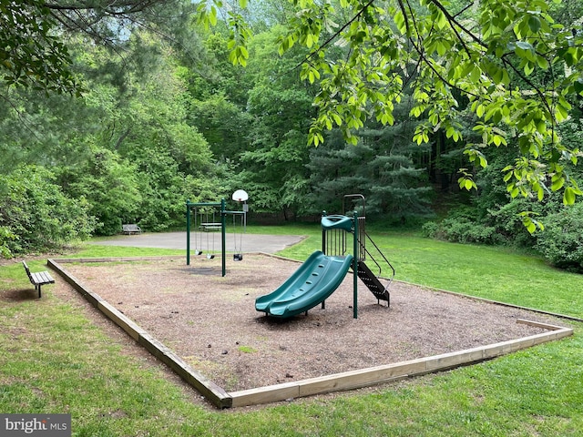 communal playground featuring a lawn