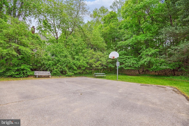 view of patio featuring community basketball court