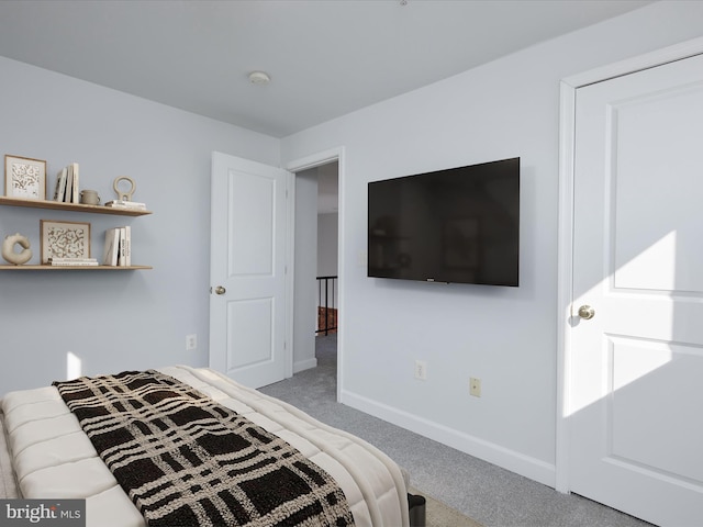 carpeted bedroom with baseboards