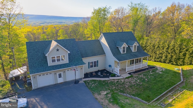 2417 Buck Hill Rd, Gerrardstown, WV 25420 - view of front facade with an attached garage, aphalt driveway, a front yard, a view of trees, and covered porch