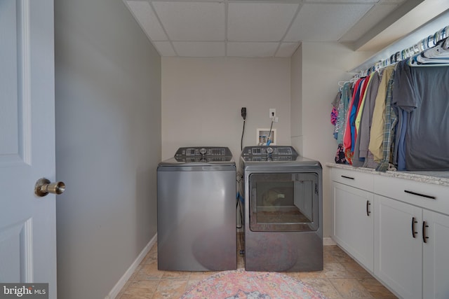 2417 Buck Hill Rd, Gerrardstown, WV 25420 - washroom with cabinet space, baseboards, stone finish flooring, and washing machine and dryer