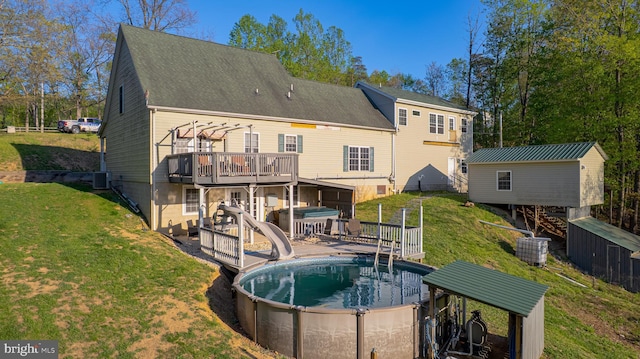 2417 Buck Hill Rd, Gerrardstown, WV 25420 - back of property with a hot tub, a yard, a wooden deck, and an outdoor pool