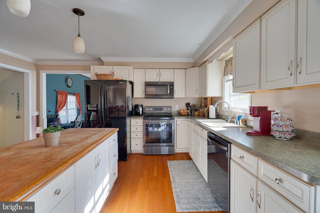 2417 Buck Hill Rd, Gerrardstown, WV 25420 - kitchen featuring stainless steel electric range oven, a sink, dishwashing machine, ornamental molding, and black fridge