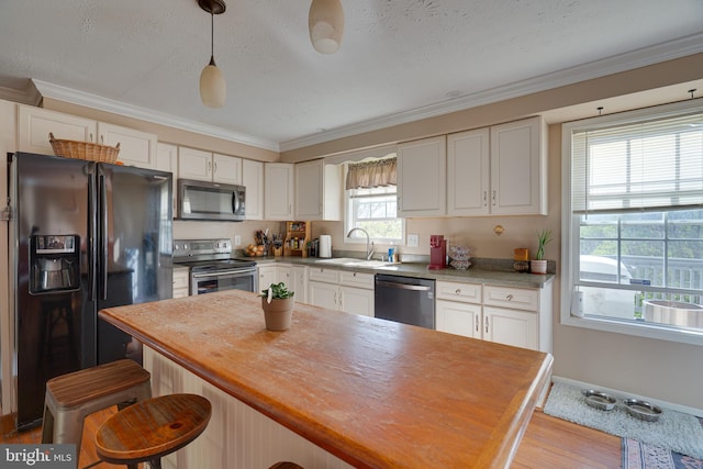 2417 Buck Hill Rd, Gerrardstown, WV 25420 - kitchen with a sink, wooden counters, stainless steel appliances, and white cabinetry