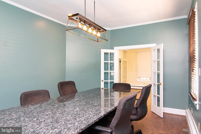 dining space featuring crown molding, french doors, and a baseboard heating unit