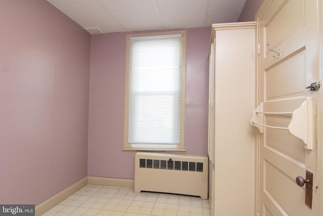 interior space with radiator heating unit and baseboards