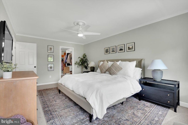 12649 Thunder Chase Dr, Reston, VA 20191 - bedroom with baseboards, a spacious closet, crown molding, a closet, and ceiling fan