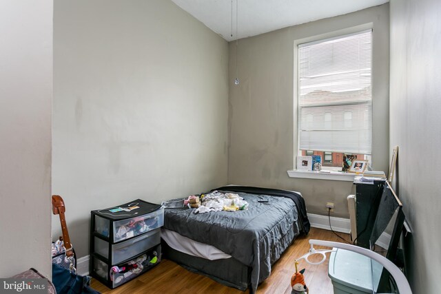 1815 Saint Paul St, Baltimore, MD 21202 - bedroom with baseboards and wood finished floors
