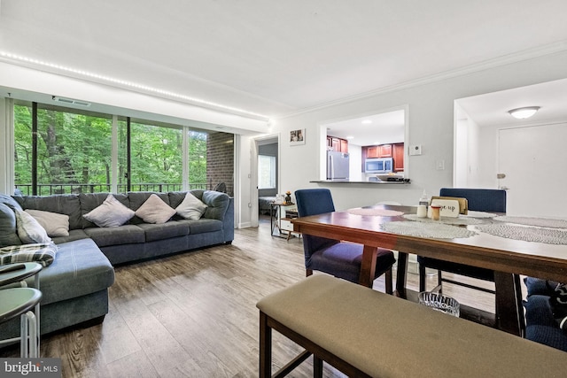 1423 Northgate Sq Unit 1423-11C, Reston, VA 20190 - living area featuring ornamental molding and wood finished floors