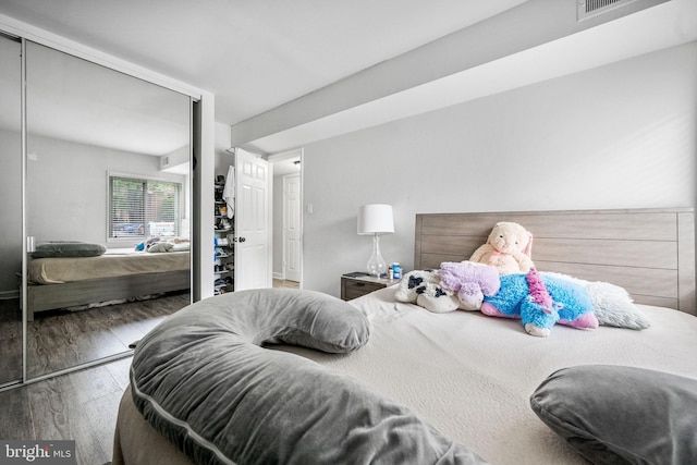 1423 Northgate Sq Unit 1423-11C, Reston, VA 20190 - bedroom featuring a closet and wood finished floors