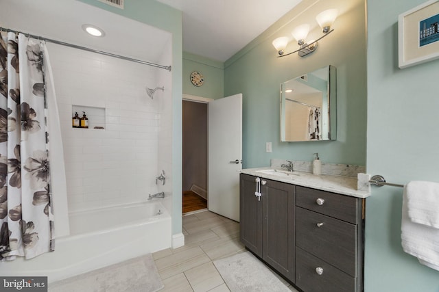 full bath with vanity, shower / tub combo with curtain, and tile patterned floors