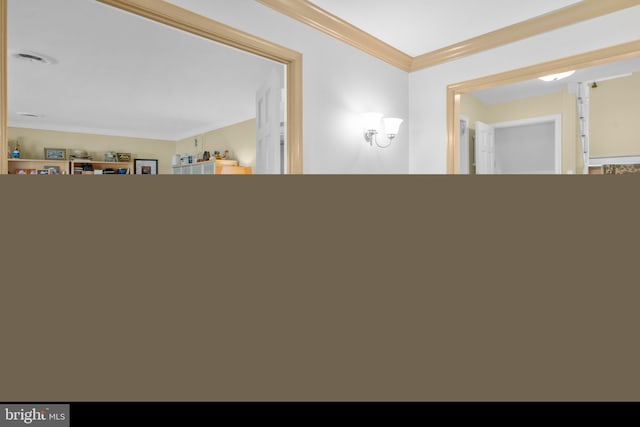 interior space with crown molding