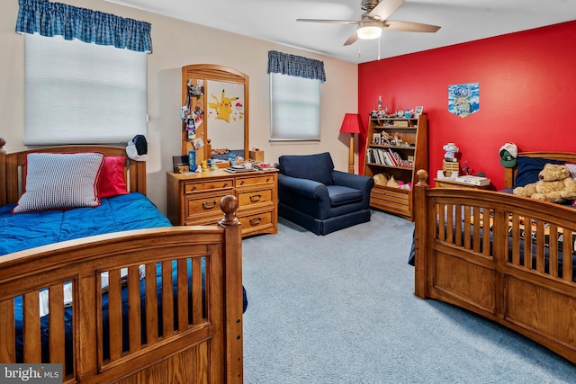 bedroom with ceiling fan and carpet flooring