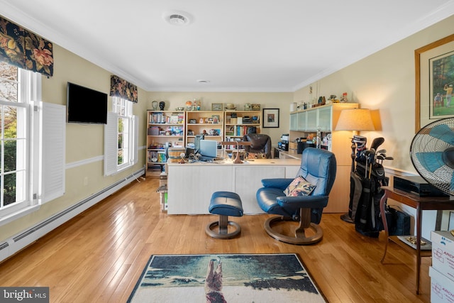 interior space with crown molding, wood-type flooring, and a baseboard heating unit