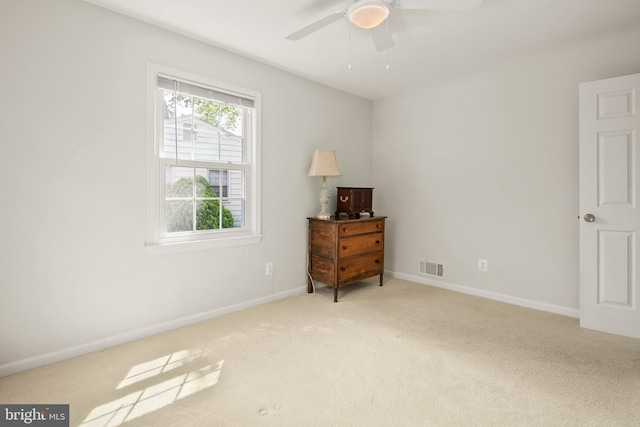 carpeted bedroom featuring a ceiling fan, baseboards, and visible vents