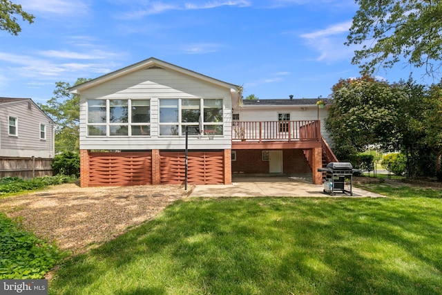 rear view of property with stairs, a patio area, fence, and a wooden deck