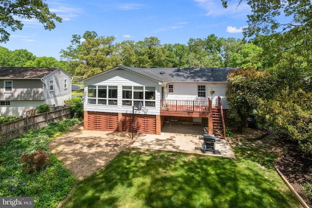 back of house with a wooden deck, fence, stairs, a patio area, and a lawn