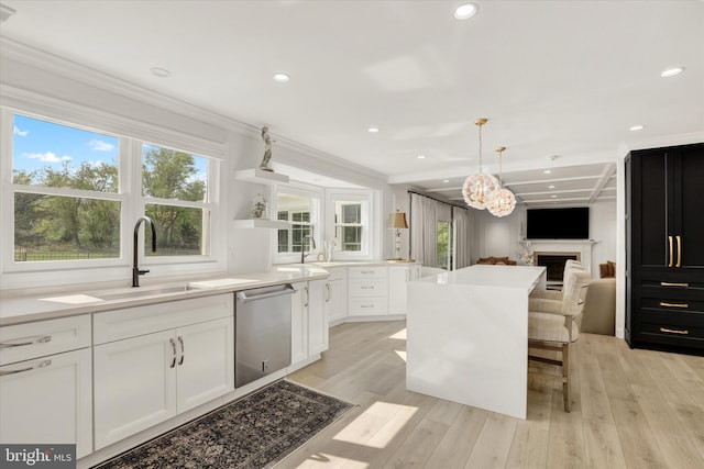 1071 Highland Rd, Newtown, PA 18940 - kitchen featuring stainless steel dishwasher, a sink, white cabinetry, light wood finished floors, and ornamental molding