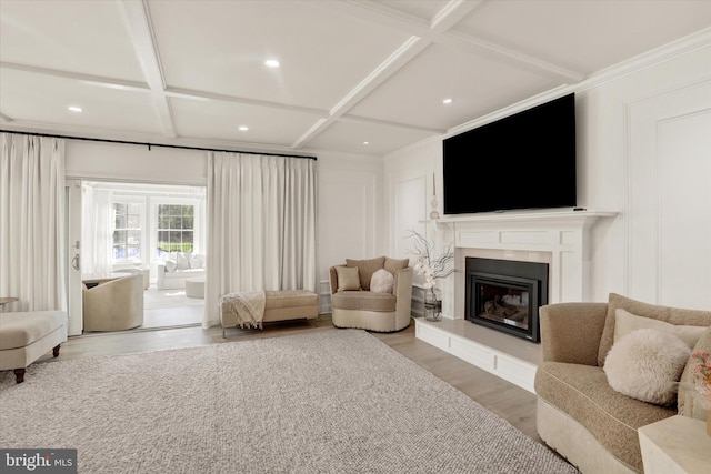 1071 Highland Rd, Newtown, PA 18940 - living area featuring a decorative wall, coffered ceiling, a glass covered fireplace, wood finished floors, and recessed lighting