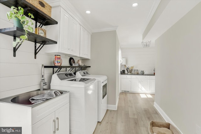1071 Highland Rd, Newtown, PA 18940 - washroom featuring separate washer and dryer, cabinet space, ornamental molding, light wood-type flooring, and recessed lighting