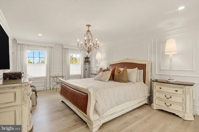 1071 Highland Rd, Newtown, PA 18940 - bedroom with crown molding, a decorative wall, a chandelier, recessed lighting, and light wood-style floors