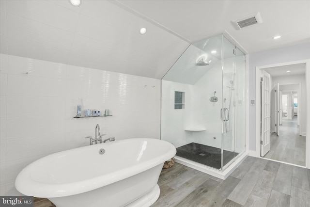 1071 Highland Rd, Newtown, PA 18940 - full bath with wood finished floors, a soaking tub, a shower stall, and recessed lighting