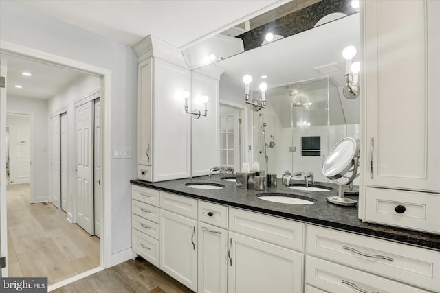 1071 Highland Rd, Newtown, PA 18940 - full bath featuring a stall shower, double vanity, and wood finished floors