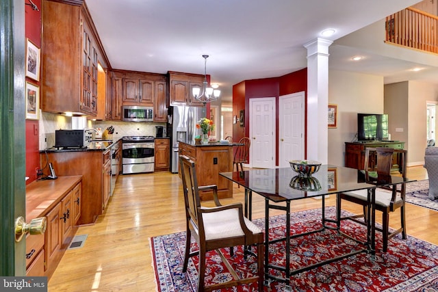 dining area featuring a chandelier, visible vents, recessed lighting, and light wood-type flooring