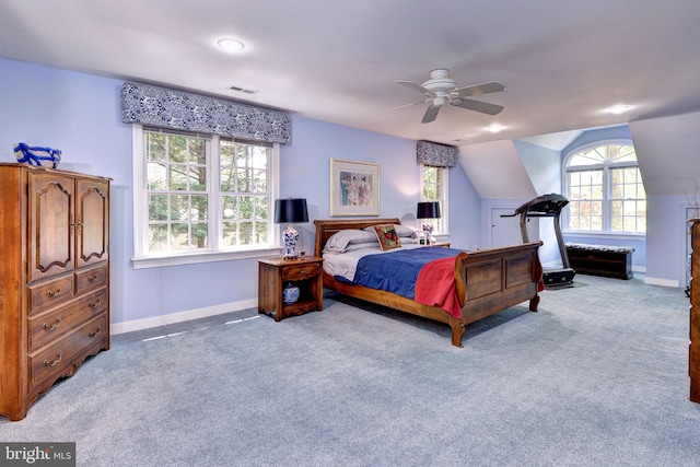carpeted bedroom featuring baseboards, a ceiling fan, lofted ceiling, and visible vents