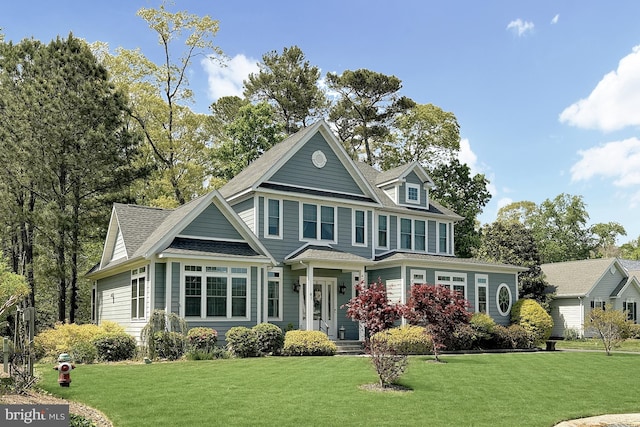 41 Kenmare Way, Rehoboth Beach, DE 19971 - view of front of home featuring a shingled roof and a front lawn