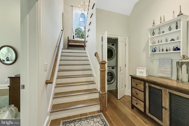 41 Kenmare Way, Rehoboth Beach, DE 19971 - stairway featuring baseboards, wood finished floors, and stacked washer / dryer