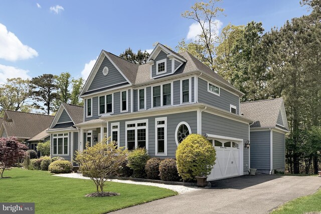 41 Kenmare Way, Rehoboth Beach, DE 19971 - view of front facade with roof with shingles, an attached garage, a front yard, and aphalt driveway