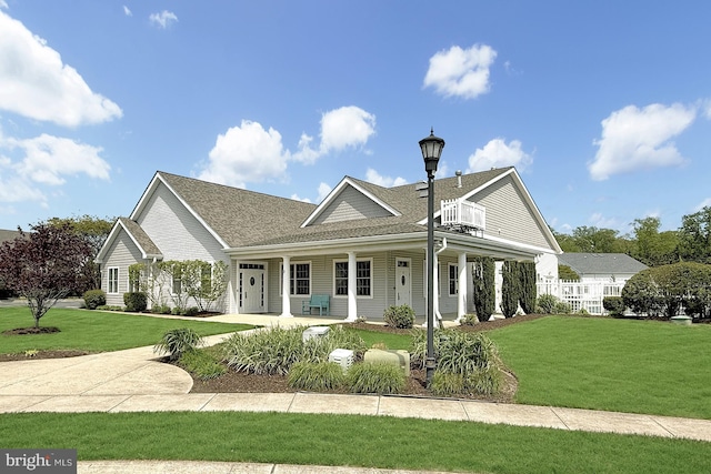 41 Kenmare Way, Rehoboth Beach, DE 19971 - farmhouse-style home with a shingled roof, a porch, and a front yard