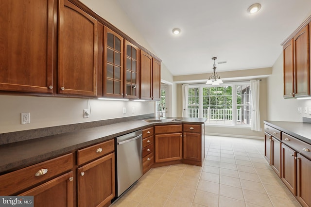 kitchen with dark countertops, dishwasher, glass insert cabinets, a sink, and light tile patterned floors