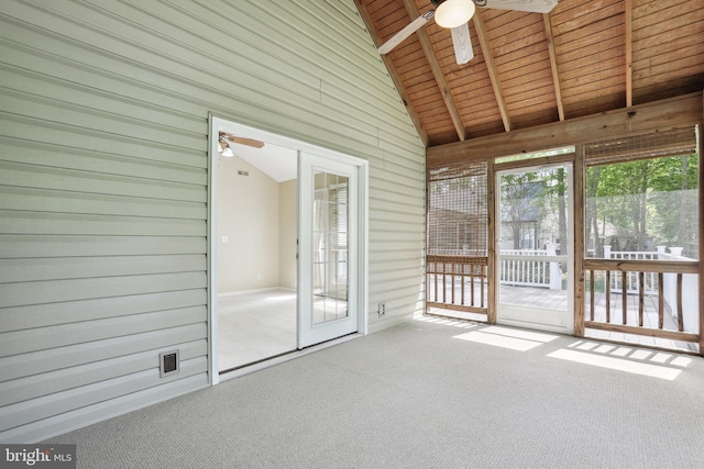 unfurnished sunroom featuring ceiling fan and beam ceiling