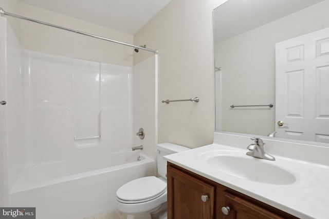 bathroom featuring toilet, bathtub / shower combination, and vanity
