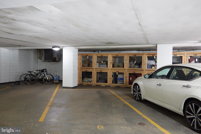 parking deck featuring concrete block wall